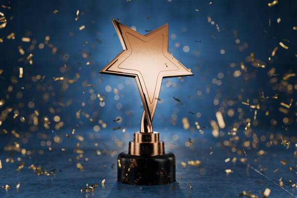 istockphoto-2062707205-612x612 Gold star on a blue background as a reward. Top Performance Award. Winners Cup. Achievements. Victory. Goal achievement concept. Winner certificate. First place in a computer game. 3D rendering.